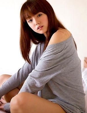 Ai Shinozaki with huge knockers plays with pillows in bed
